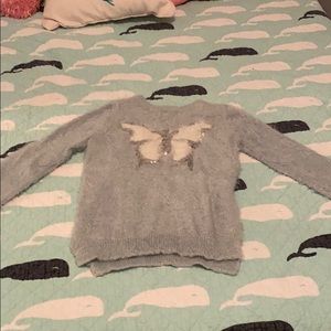 A Beautiful butterfly embellished sweater.
